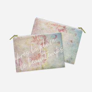 two small zipper bags with a quote on them