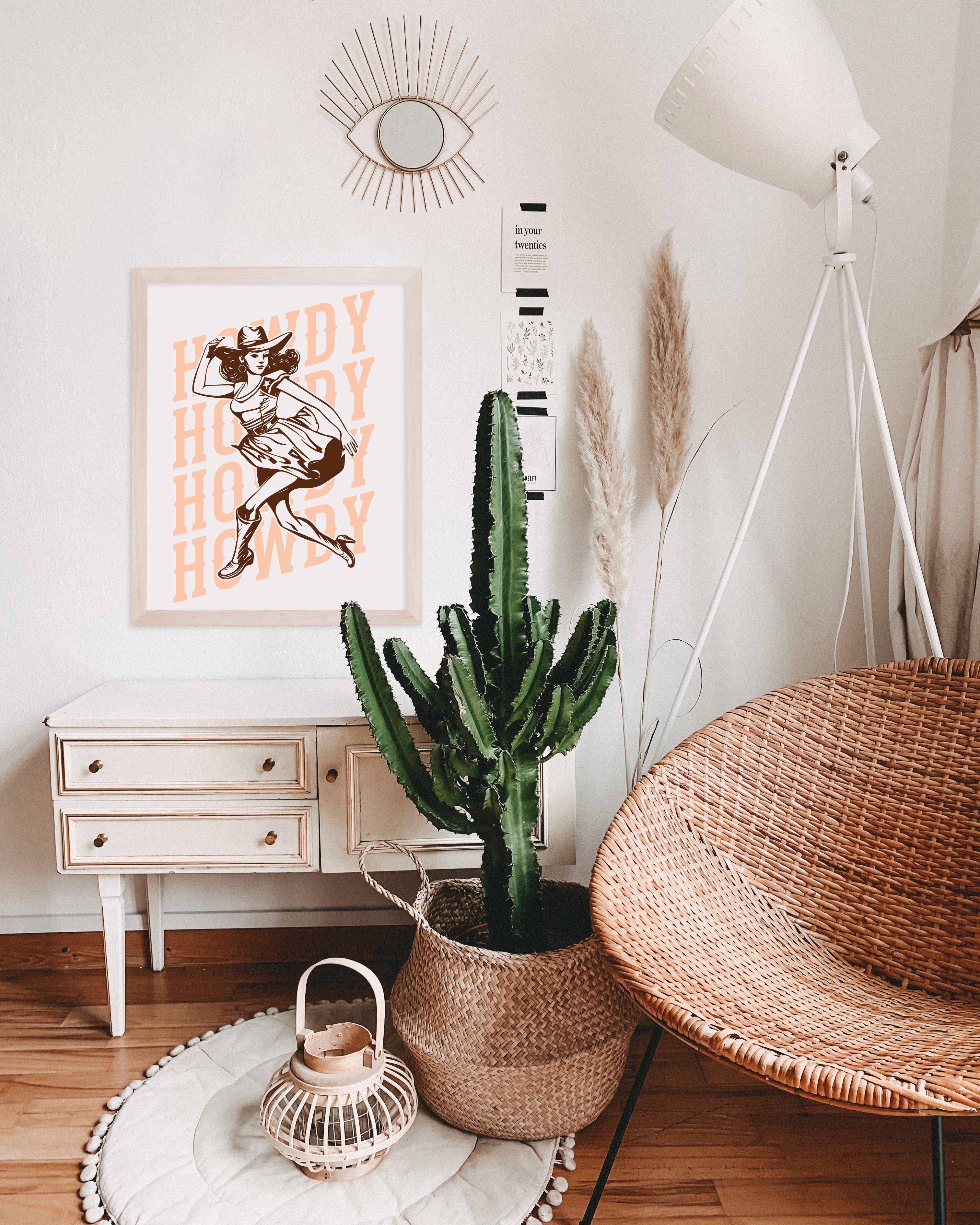 a living room with a wicker chair and a cactus