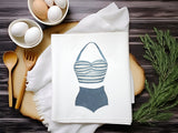 a picture of a bathing suit on a napkin