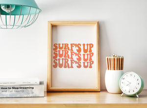 a picture frame sitting on top of a desk next to a clock