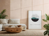 a living room with a white sofa, a wooden coffee table, and a framed poster of the city of Bellingham on the wall.