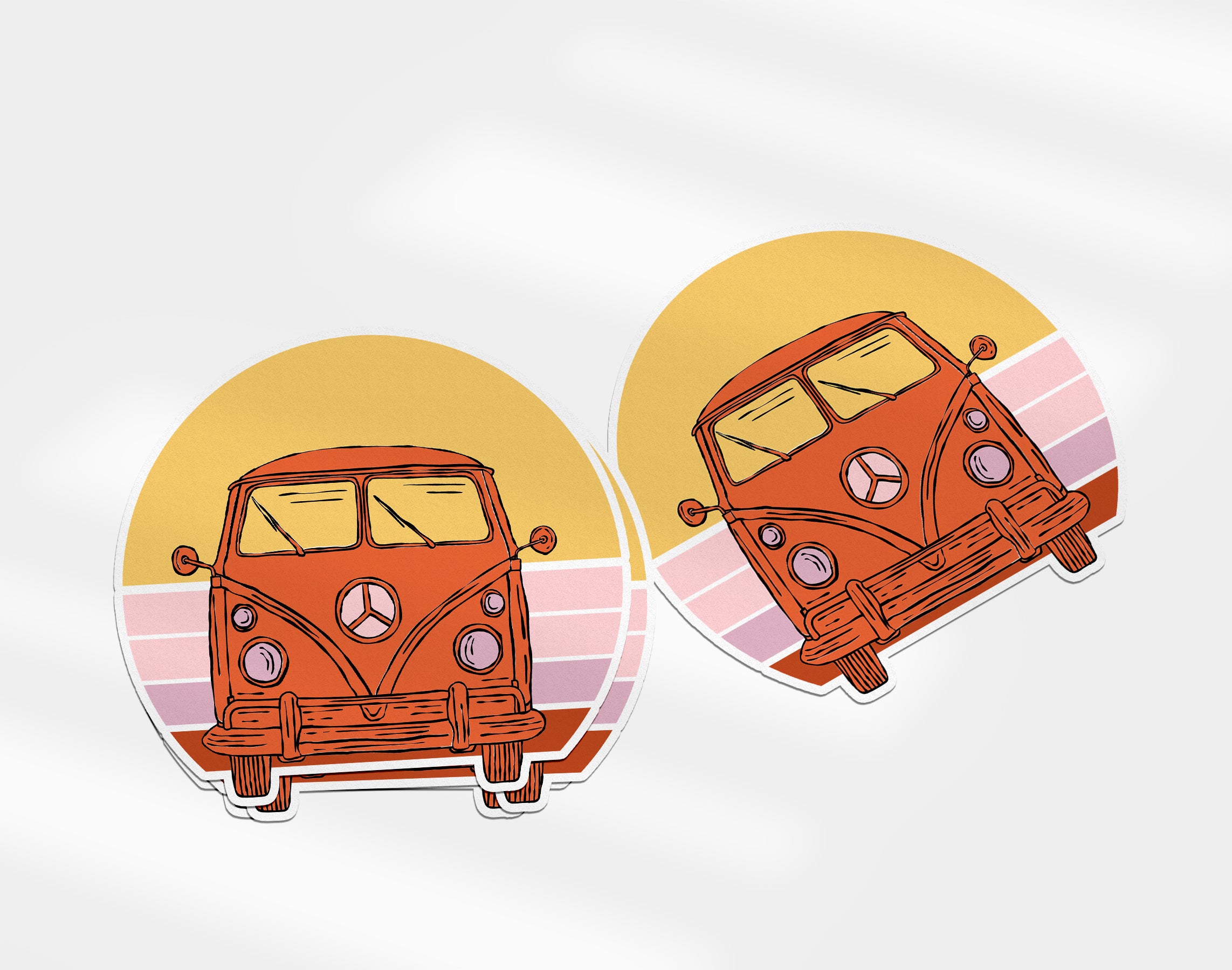 two stickers of a vw bus on a white background