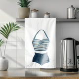 a tea towel with a picture of a bathing suit on it