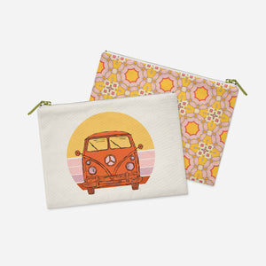 two small bags with a picture of a bus on them