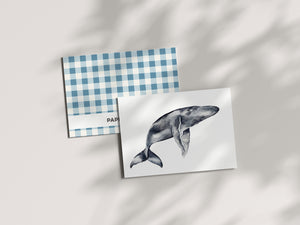 a card with a picture of a whale on it