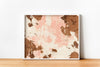 a picture of a brown and pink painting on a white wall