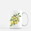 a coffee mug with a painting of lemons on it