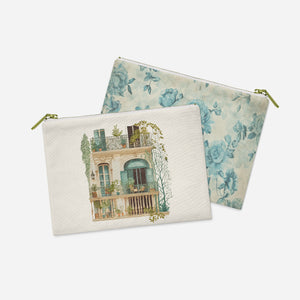 two zippered pouches with a picture of a house on them