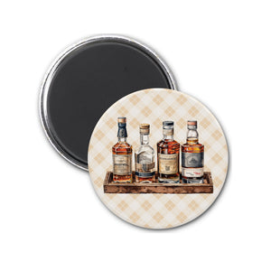 three bottles of liquor on a wooden tray