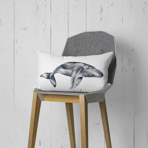 a pillow with a picture of a whale on it