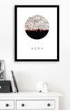 a framed artwork depicting a map of Agra, India, with a city skyline in the background.