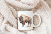 a mug with a picture of a bison on it