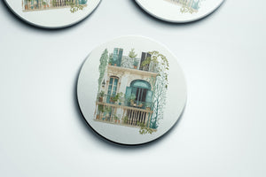 three coasters with a picture of a building on them