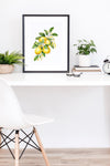 a white table with a white chair and a picture of lemons