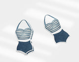 a pair of swimsuits cut out of paper