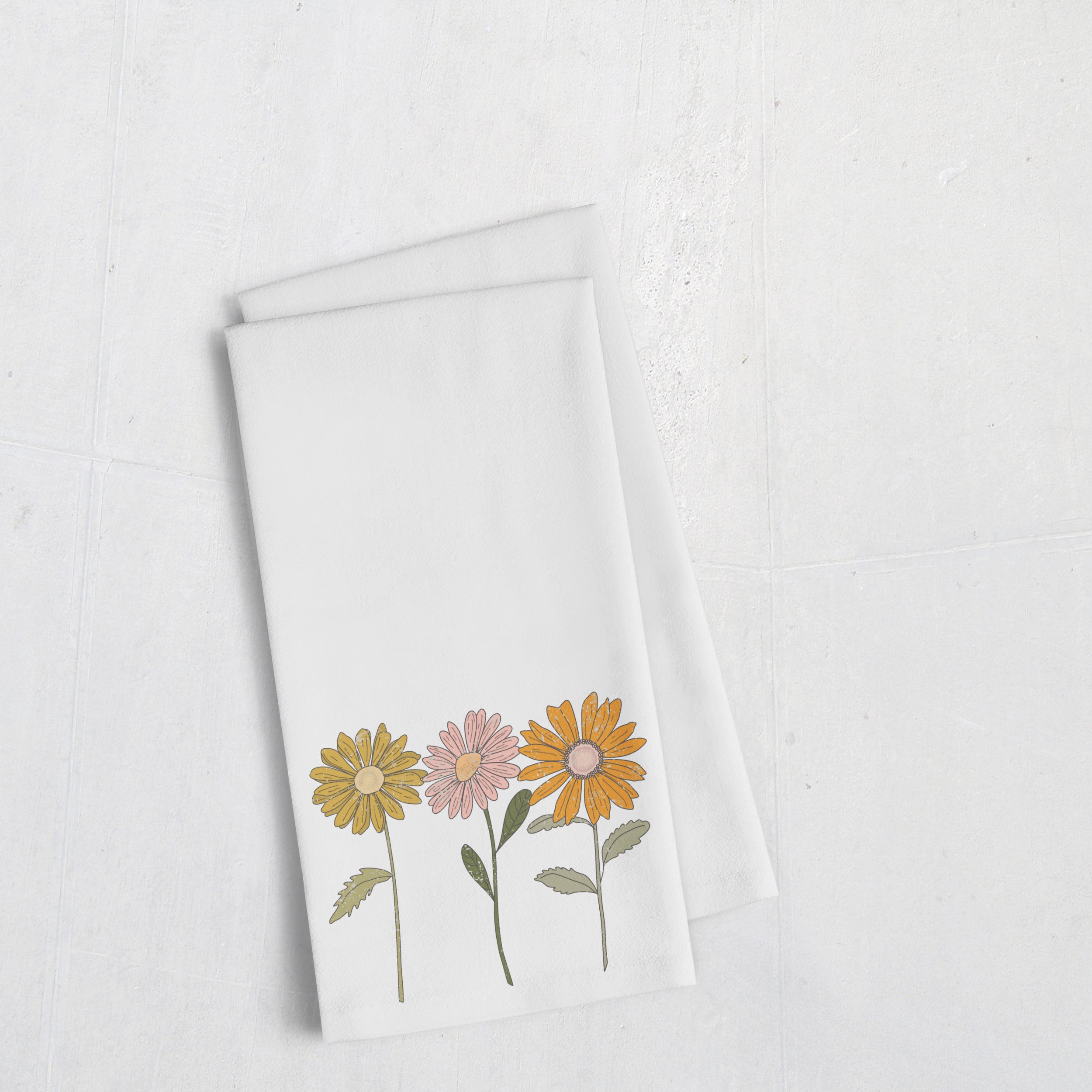 a white towel with a bunch of flowers on it