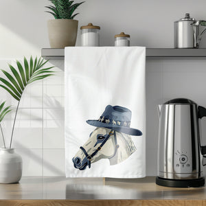 a tea towel with a picture of a horse wearing a hat