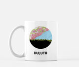 Duluth, Minnesota map and skyline mug, a circular city map with the skyline in silhouette