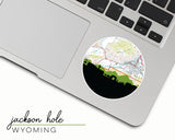 Jackson Hole, Wyoming map and skyline vinyl sticker, a circular city map with the skyline in silhouette