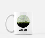 Warner, New Hampshire map and skyline mug, a circular city map with the skyline in silhouette
