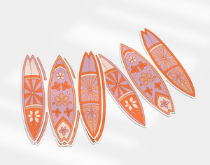 a group of surfboards sitting next to each other