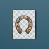 a picture of a horseshoe hanging on a wall