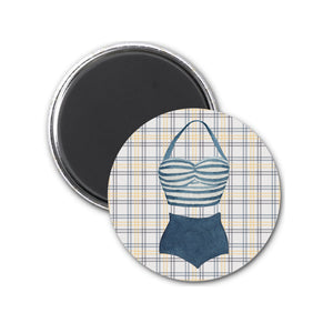 a button with a bathing suit on it