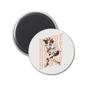 a round magnet with an image of a woman in a cowboy hat