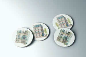 three plates with a picture of a building on them