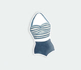 a sticker of a woman's swimsuit on a white background