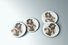 a set of three buttons with a woman in a cowboy hat