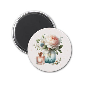 a bottle of perfume and a flower on a white background