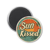 a magnet with the words sun kissed on it