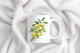 a coffee mug with a painting of lemons on it