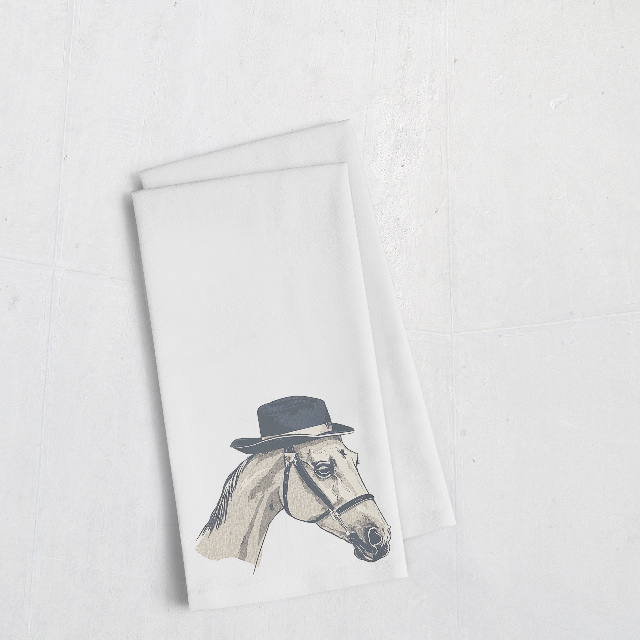a white towel with a picture of a horse wearing a hat