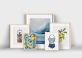 a collection of framed art with lemons and lemons