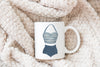 a white mug with a picture of a bathing suit on it