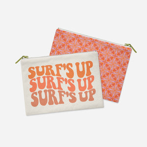 a pair of orange and white pouches with words on them