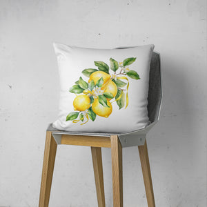 a white pillow with yellow lemons on it