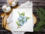 a picture of some blueberries on a napkin