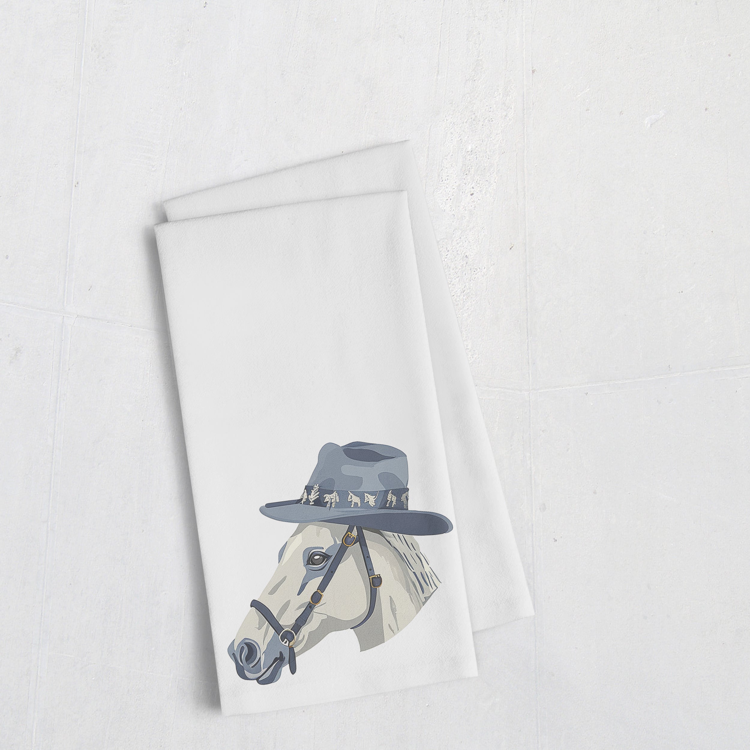 a tea towel with a picture of a horse wearing a hat
