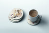 a cup of coffee sitting on top of a saucer