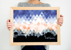 Auburn Alabama art print. Features the Auburn Alabama skyline and a geometric background. In blue and orange and shown in a natural brown frame. Other colors and frame options available. Designed by Paperfinch.