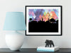 Auburn Alabama art print. Features the Auburn Alabama skyline and a geometric background. In purple and shown in a black frame. Other colors and frame options available. Designed by Paperfinch.