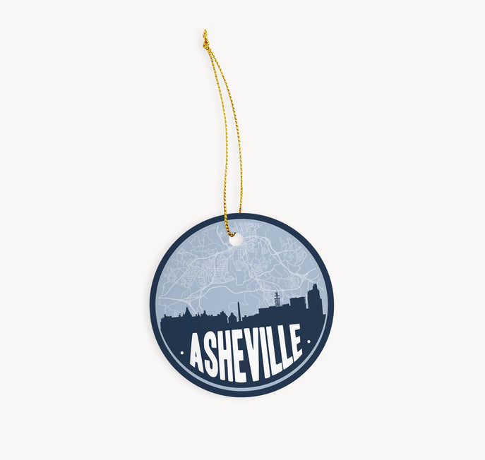 Asheville, North Carolina Christmas ornament in blue - featuring the Asheville skyline and an Asheville road map. By Paperfinch Design