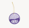 Asheville, North Carolina Christmas ornament in purple - featuring the Asheville skyline and an Asheville road map. By Paperfinch Design