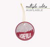 Asheville, North Carolina Christmas ornament featuring the Asheville skyline and an Asheville road map. By Paperfinch Design