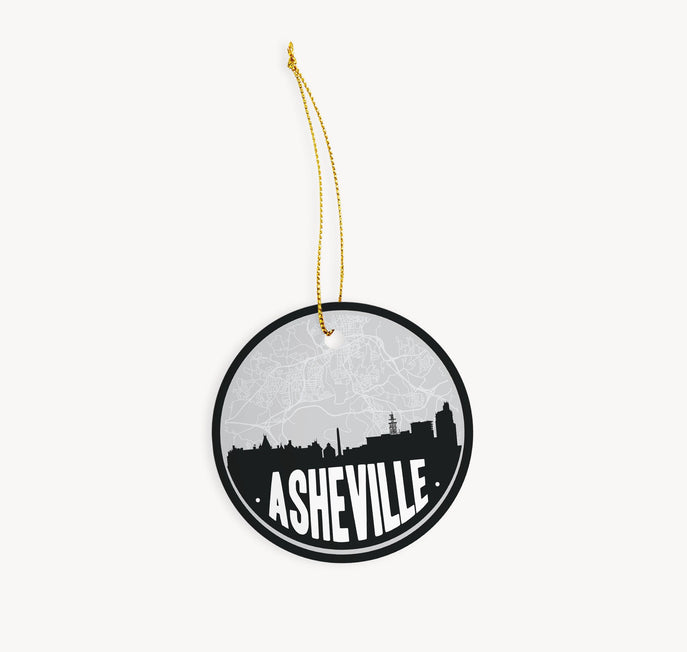 Asheville, North Carolina Christmas ornament in black - featuring the Asheville skyline and an Asheville road map. By Paperfinch Design