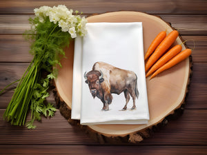 a napkin with a picture of a buffalo on it next to some carrots