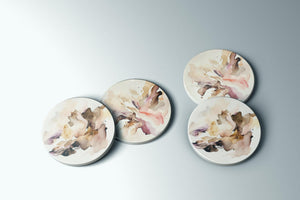 three plates with a painting of flowers on them